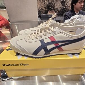 Onitsuka Tiger Unisex Cream Leather Sneakers with Navy & Red Stripes.